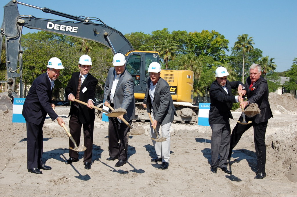 The mayor, developer, and CEO Bob Glaser of Smith & Associates shovel a bit of dirt!