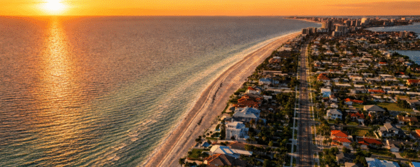 Aerial view of St. Petersburg Florida waterfront skyline at sunset with Gulf in the background