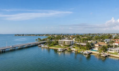 Aerial view of waterfront homes, docks, and boats in Coquina Key, St. Petersburg, FL